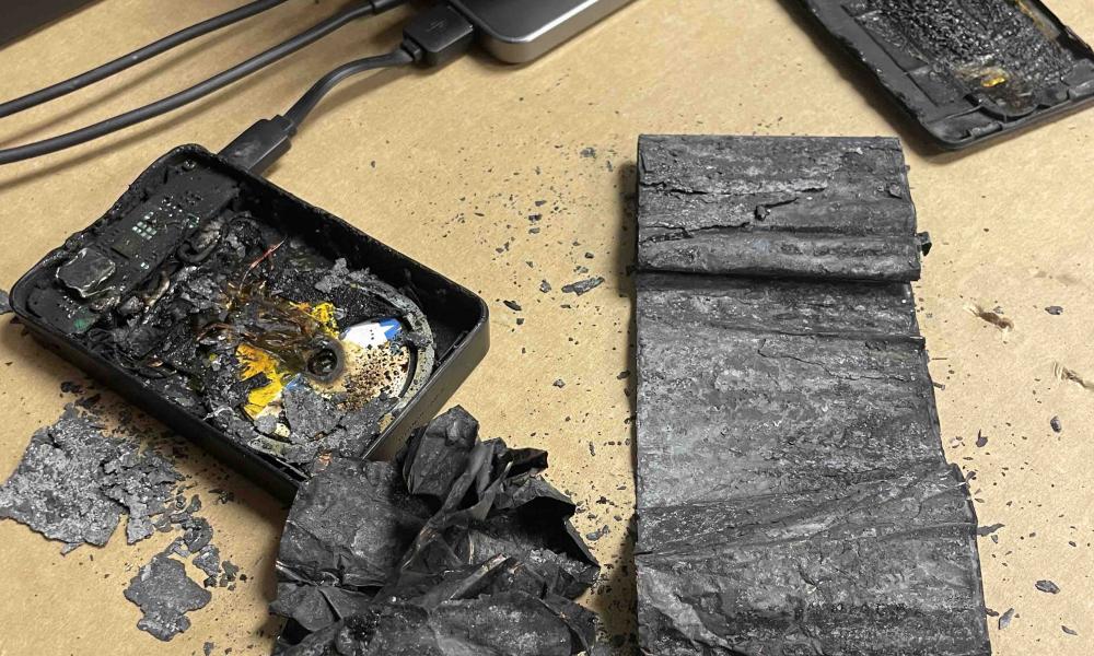 burnt device and charger on a table