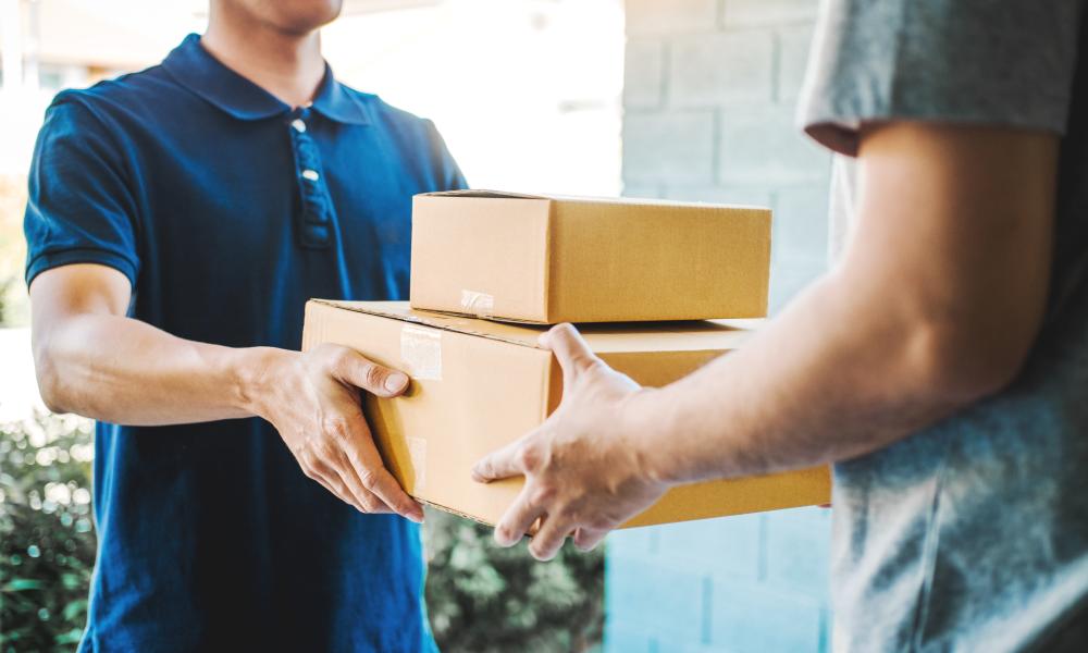 Handing off a cardboard box