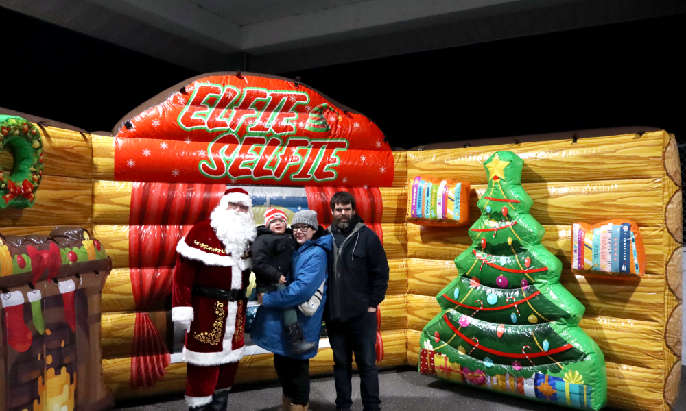 A family photo with Santa at the Tree Lighting.