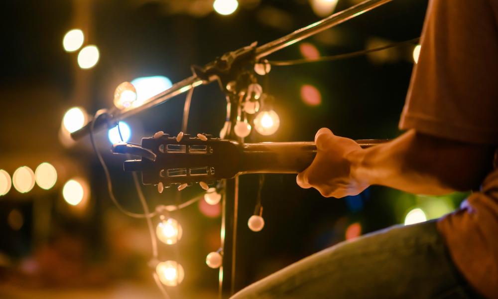 A person playing guitar.
