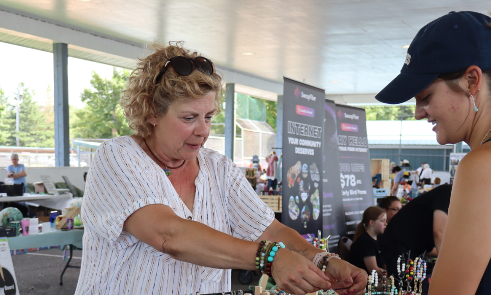 Vendor showing their product to a customer