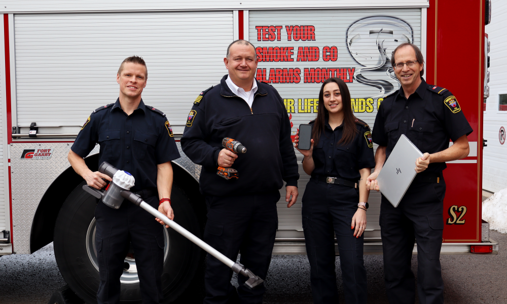 Fire chief, fire staff, and volunteer firefighters indicating several types of lithium ion battery devices