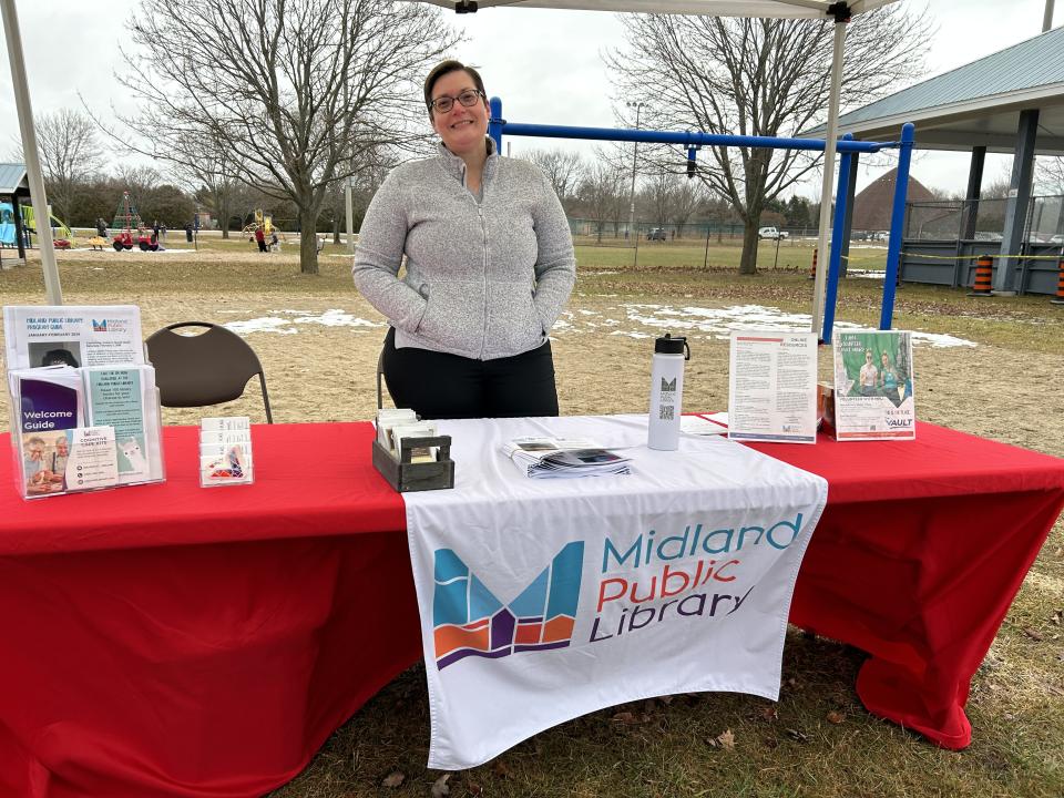 Staff for the Midland Public Library showcasing their booth