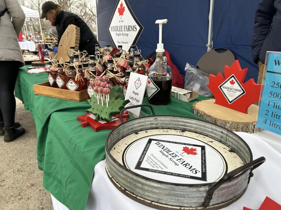 Windlee Farms table with staff making maple taffy in the background