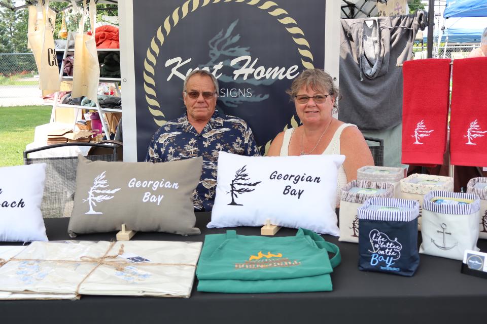 Couple in their Knot Home Designs booth