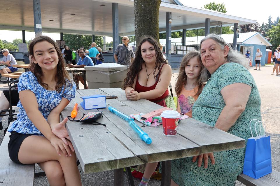 Family enjoying the live music at a picnic table