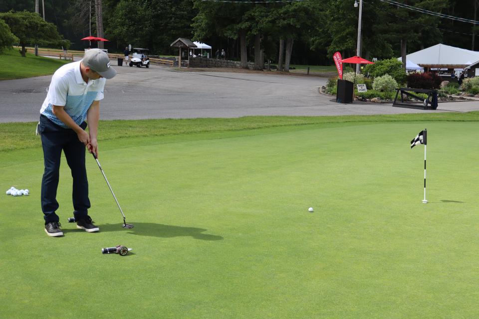 Male golfer at the Mayor's putting challenge