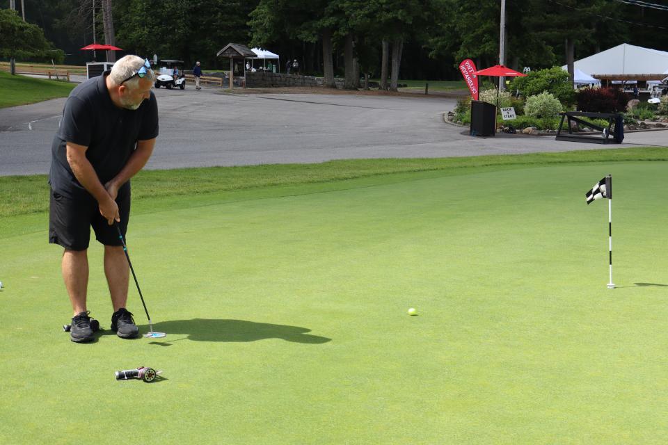 Male golfer at the Mayor's putting challenge