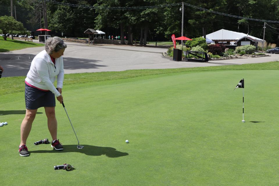 Female golfer at the Mayor's putting challenge