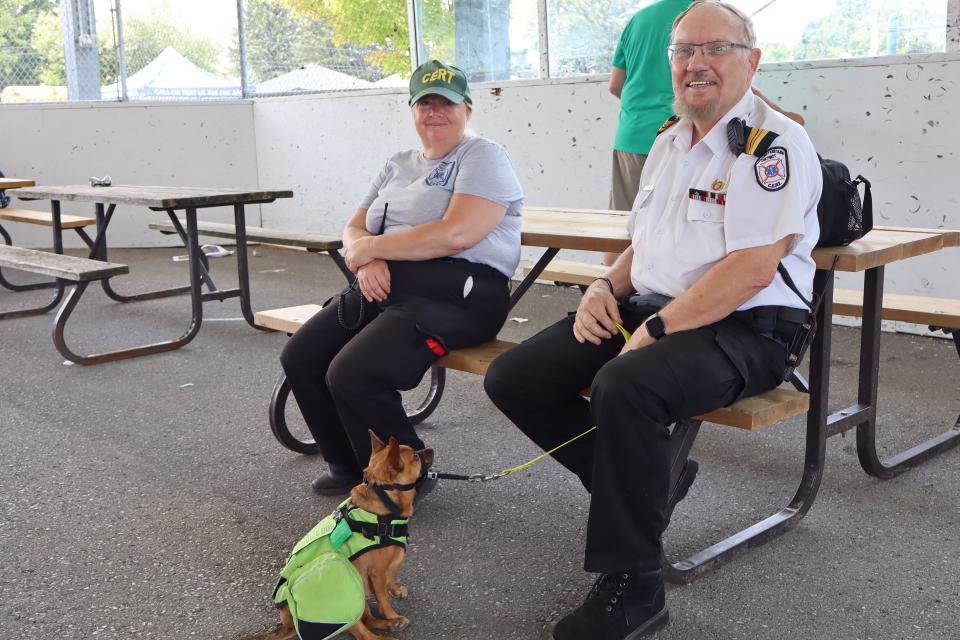 Paramedics and their service dog in the pavillion