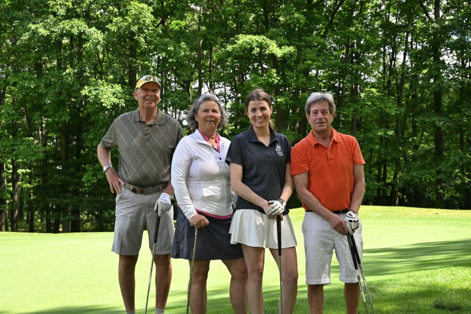 Mixed golf foursome out on the greens