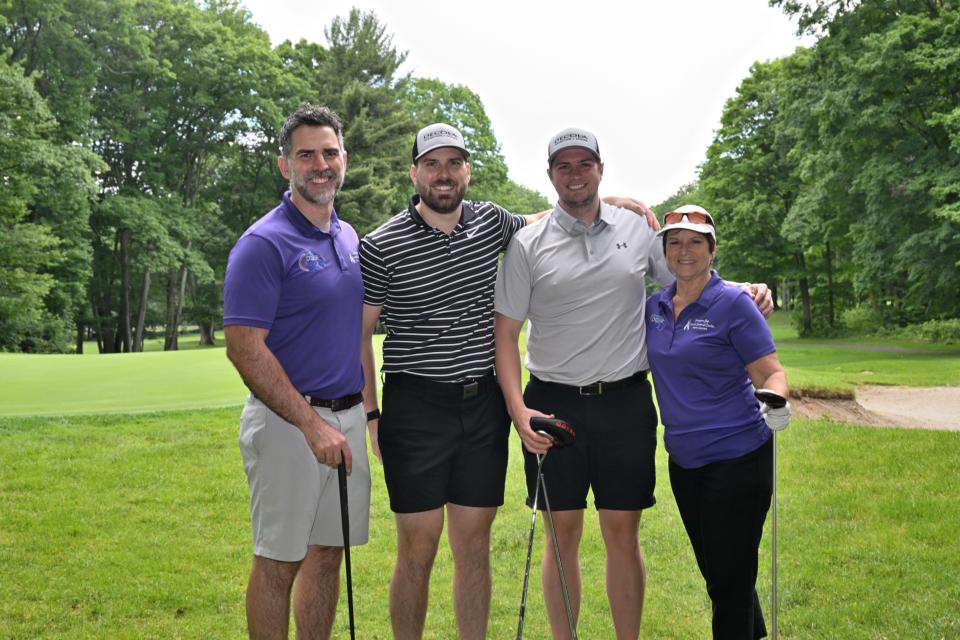 Mixed golf foursome out on the greens