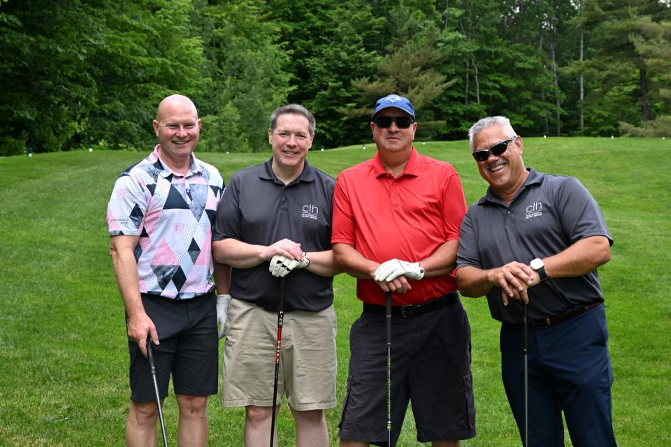 Men's golf foursome out on the greens