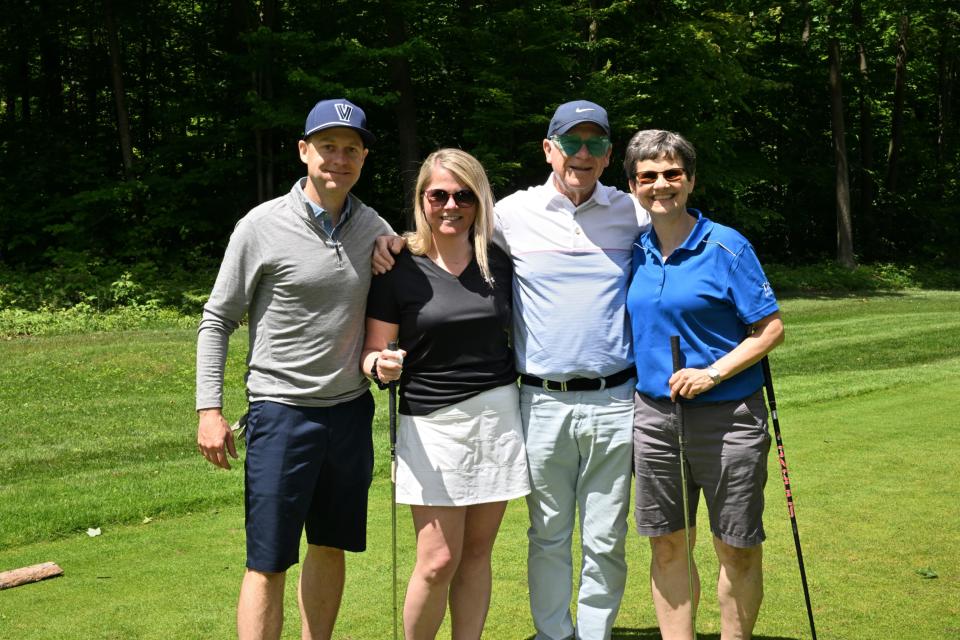 Mixed golf foursome out on the greens