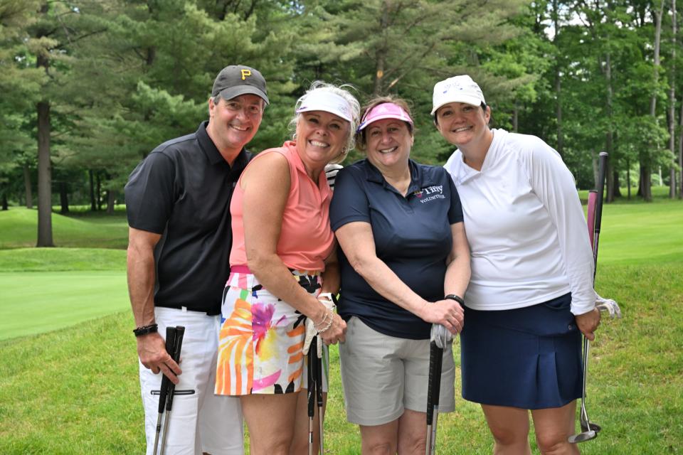 Mixed golf foursome out on the greens