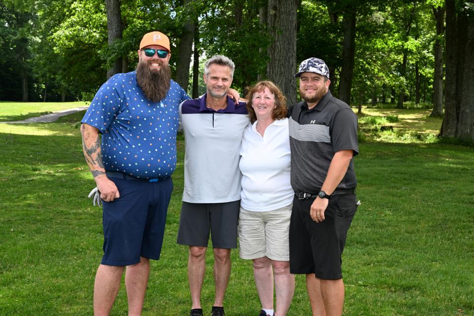 Mixed golf foursome out on the greens