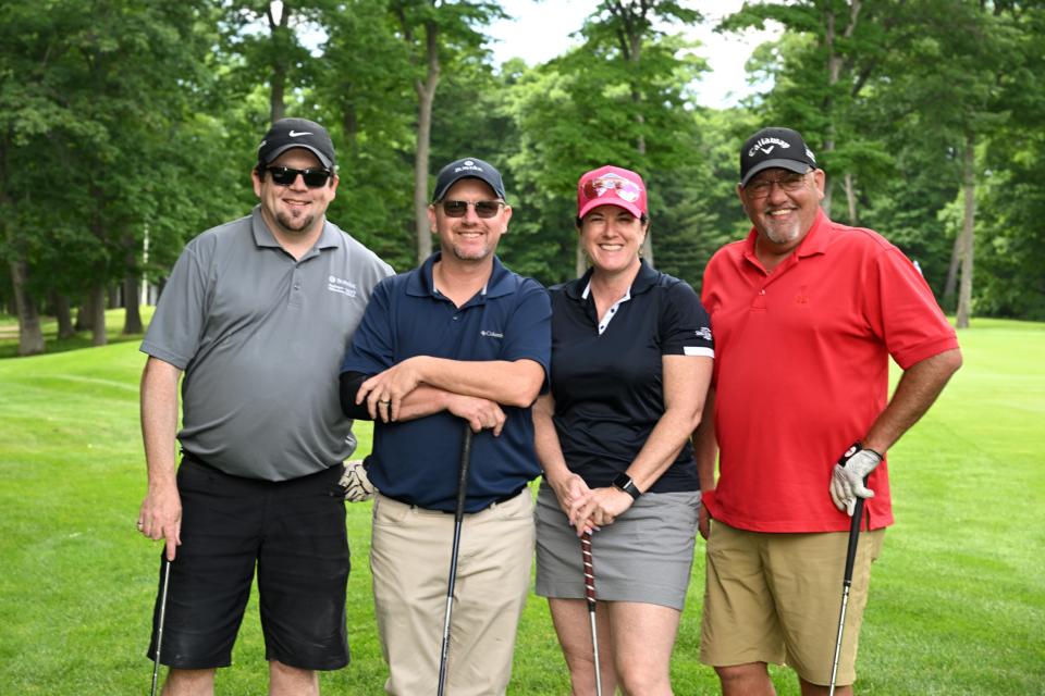 Mixed golf foursome out on the greens