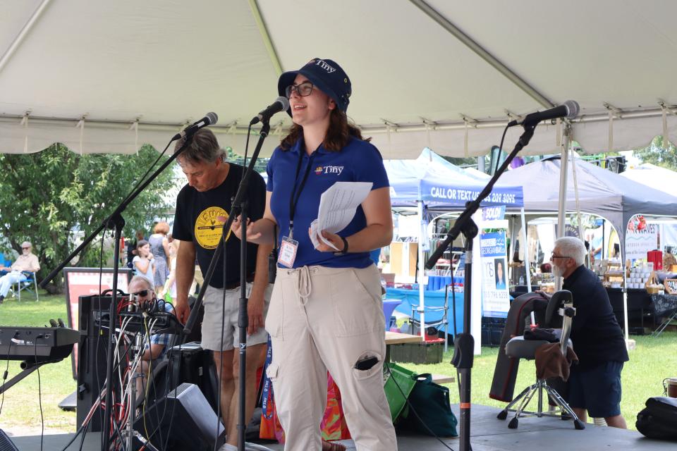 Staff making an announcement at the Community BBQ