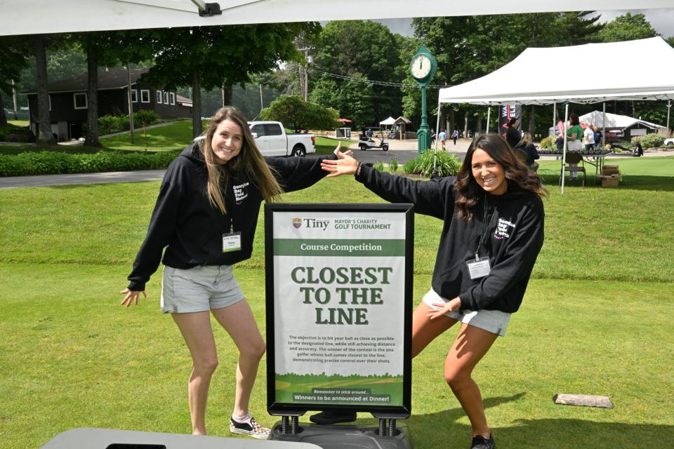 Volunteers presenting the closest to the line hole challenge