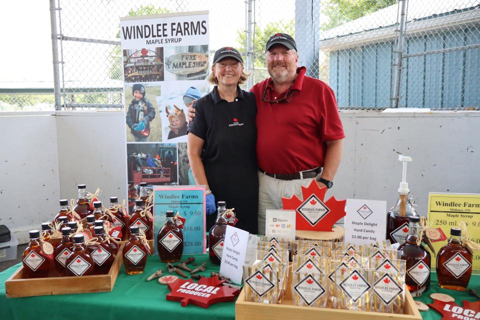 Windlee Farms owners in their booth at the vendor fair