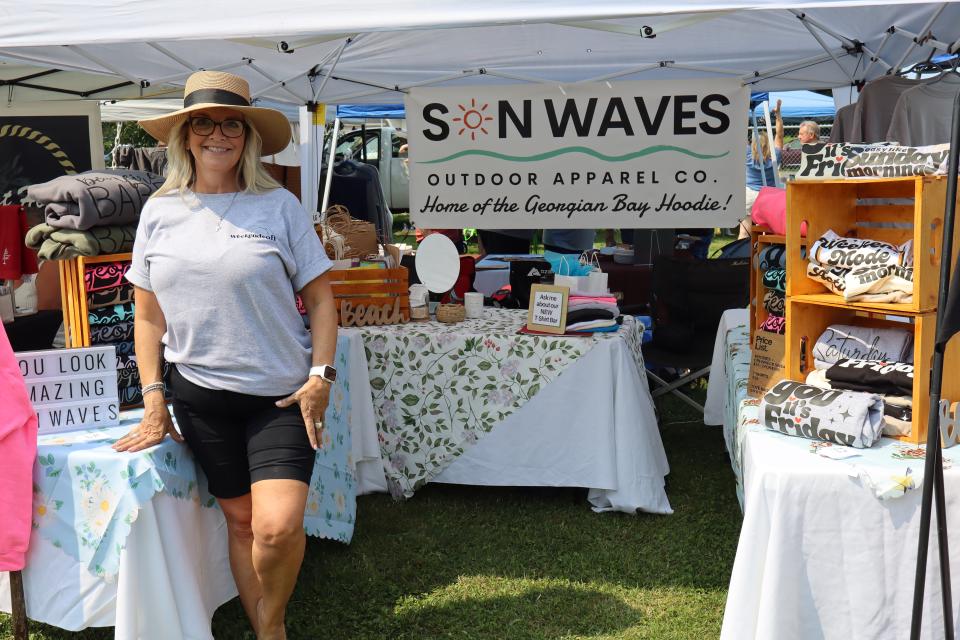 Woman posing in their Son Waves booth