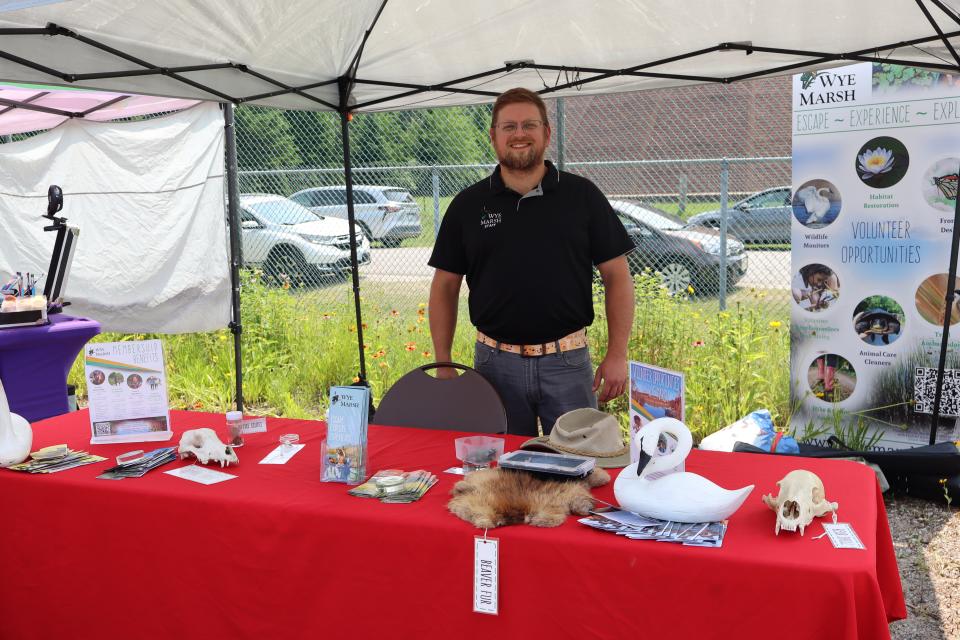 Wye Marsh staff at their table full of various animal wares