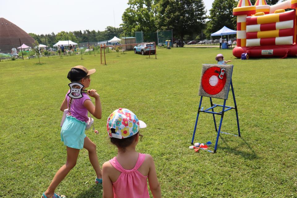 Young girl playing a kids-friendly axe throwing game