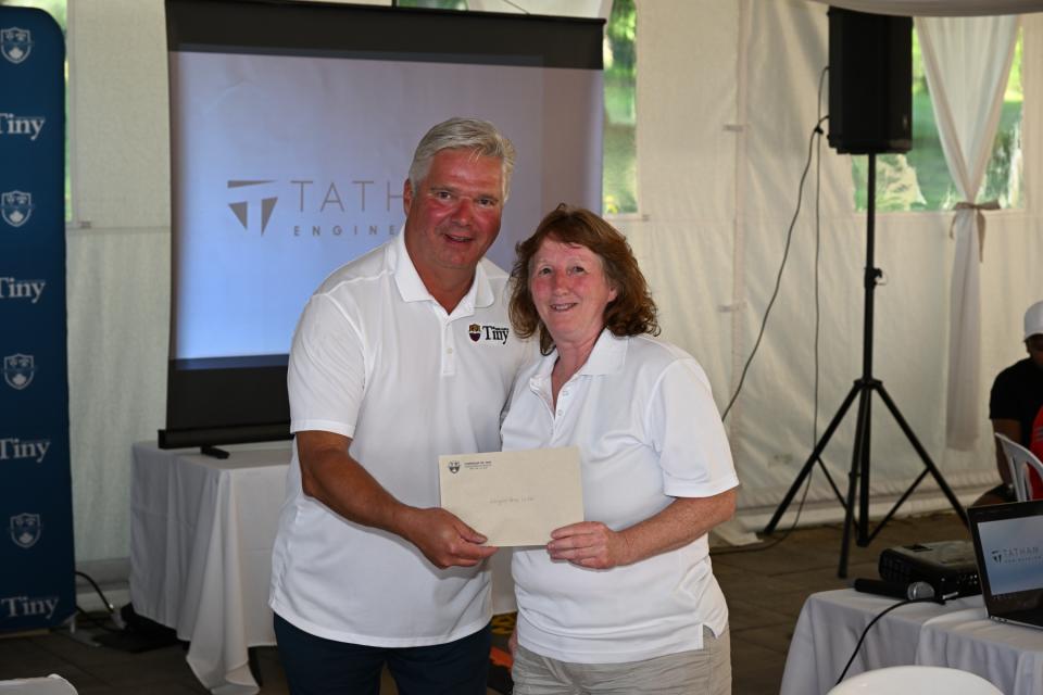 Mayor Evans congratulating the ladies longest drive winner