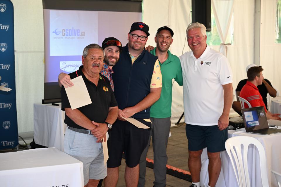 Mayor Evans congratulating the winning men's team