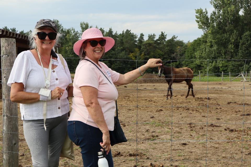 two women visiting the farm animals