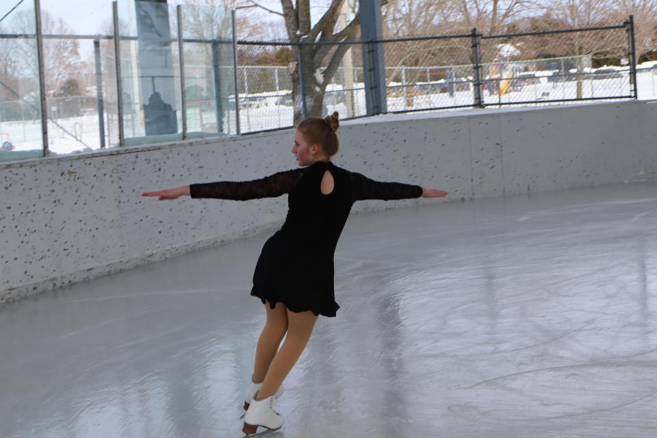 emvale skater in a black dress outfit