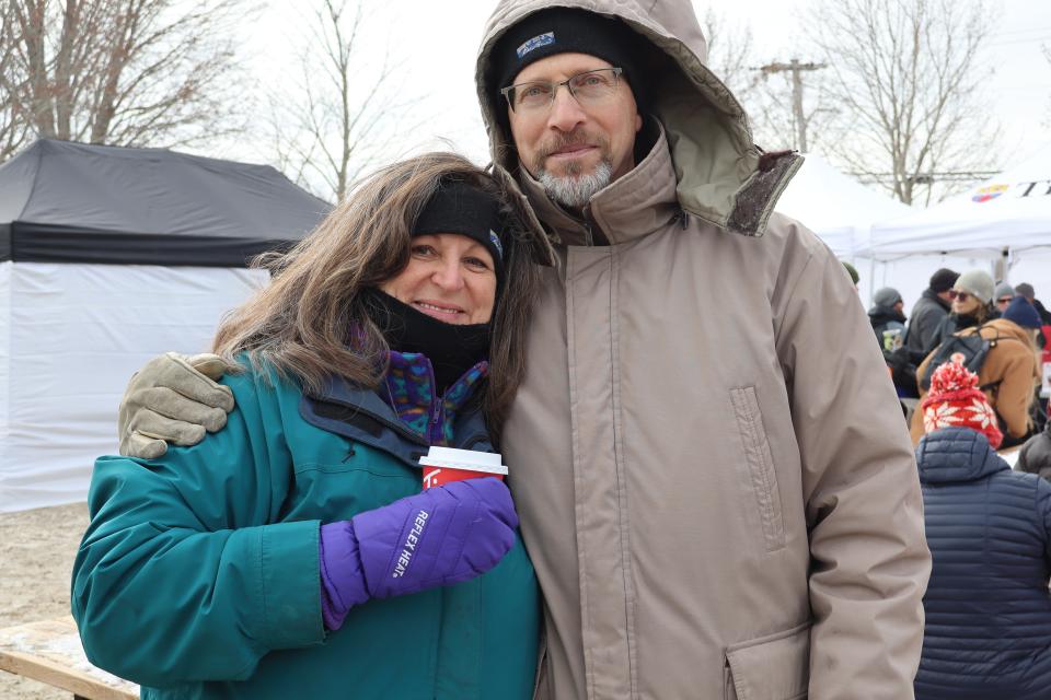 couple enjoying free hot chocolate at the event