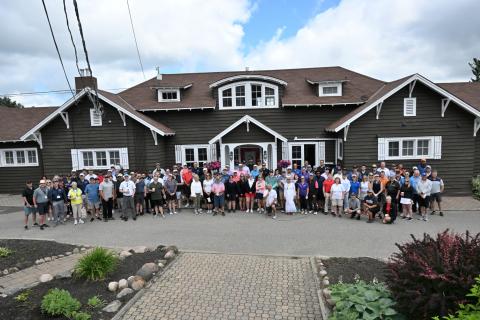 Group shot of all golf participants from a higher angle