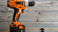 orange drill with a lithium-ion battery